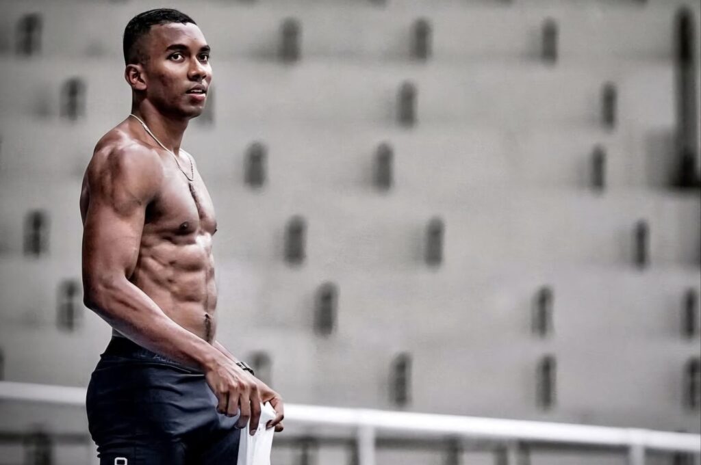 Animesh Kujur sprinting on a training track in a session, focused and in motion.